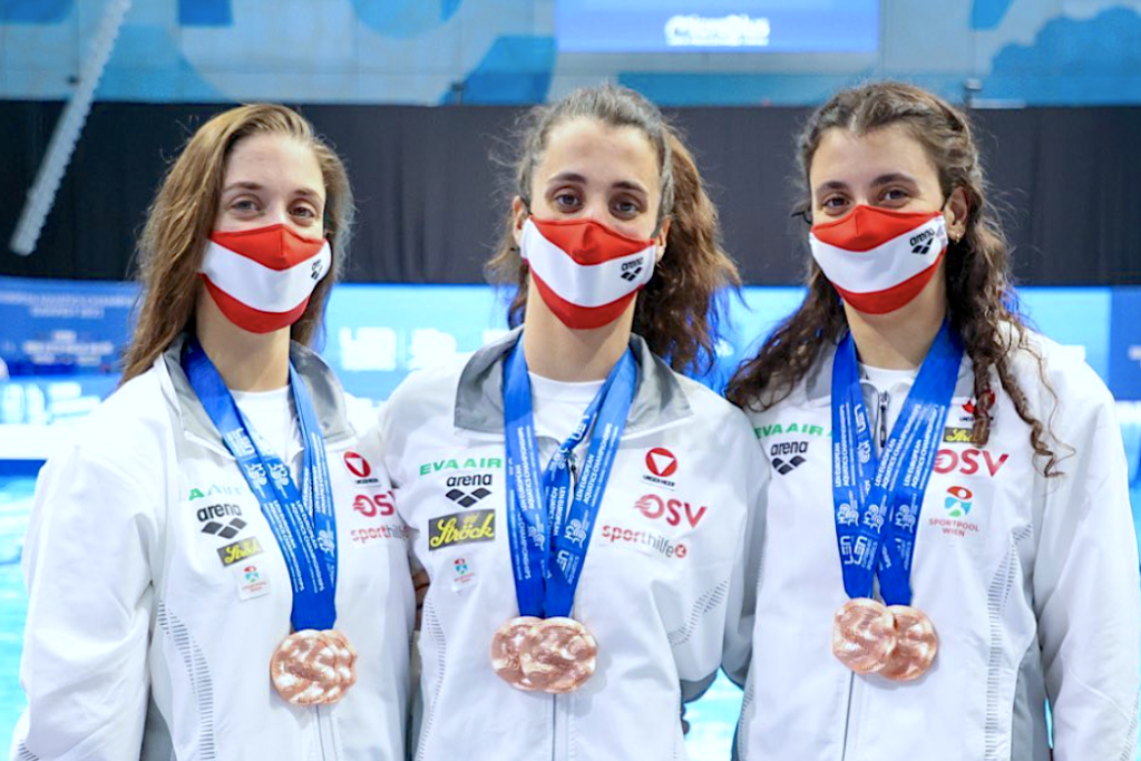 Alexandri triplets pose for a photo with their bronze medals at the European Championships